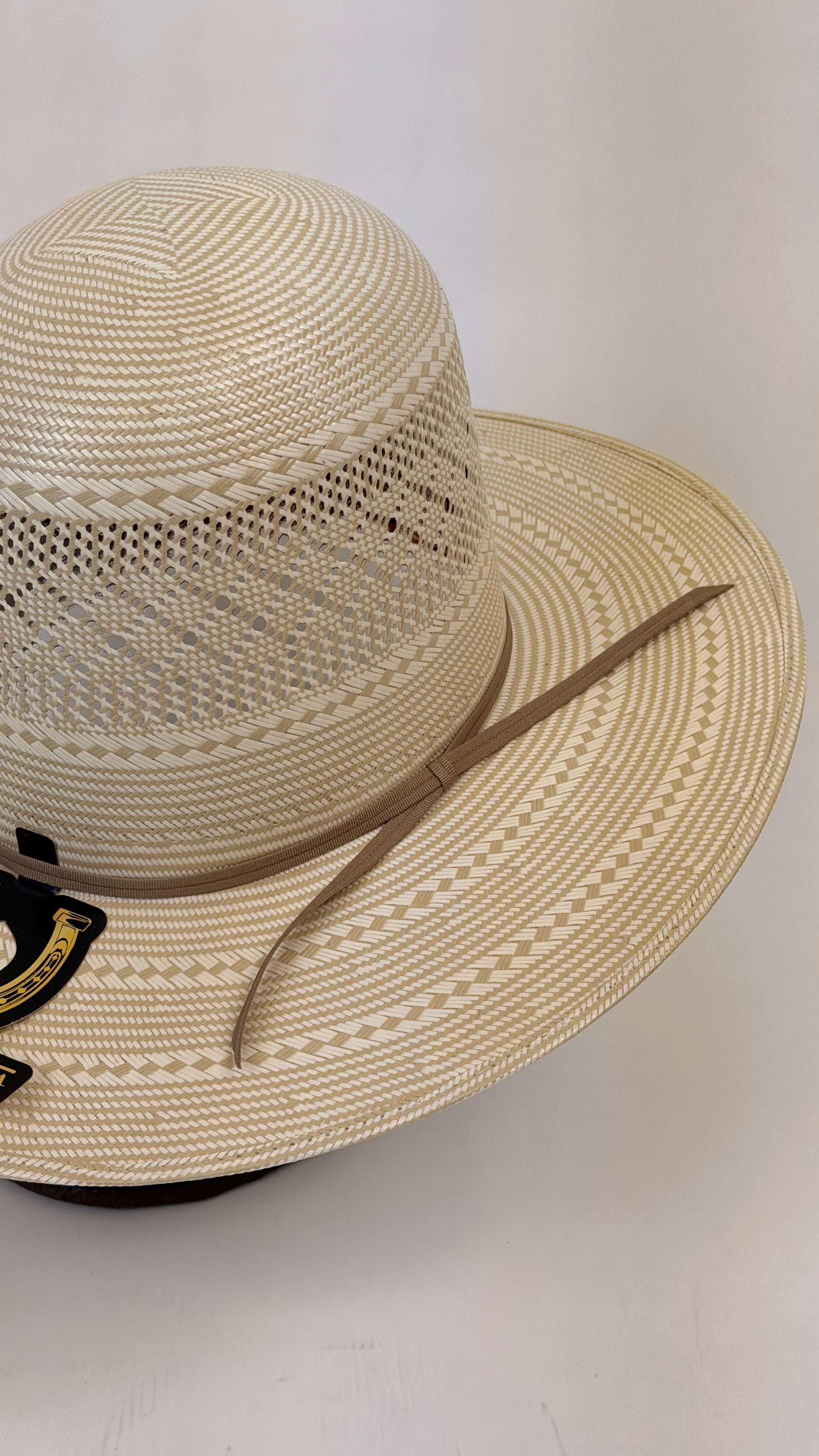 Beige straw hat with a wide brim