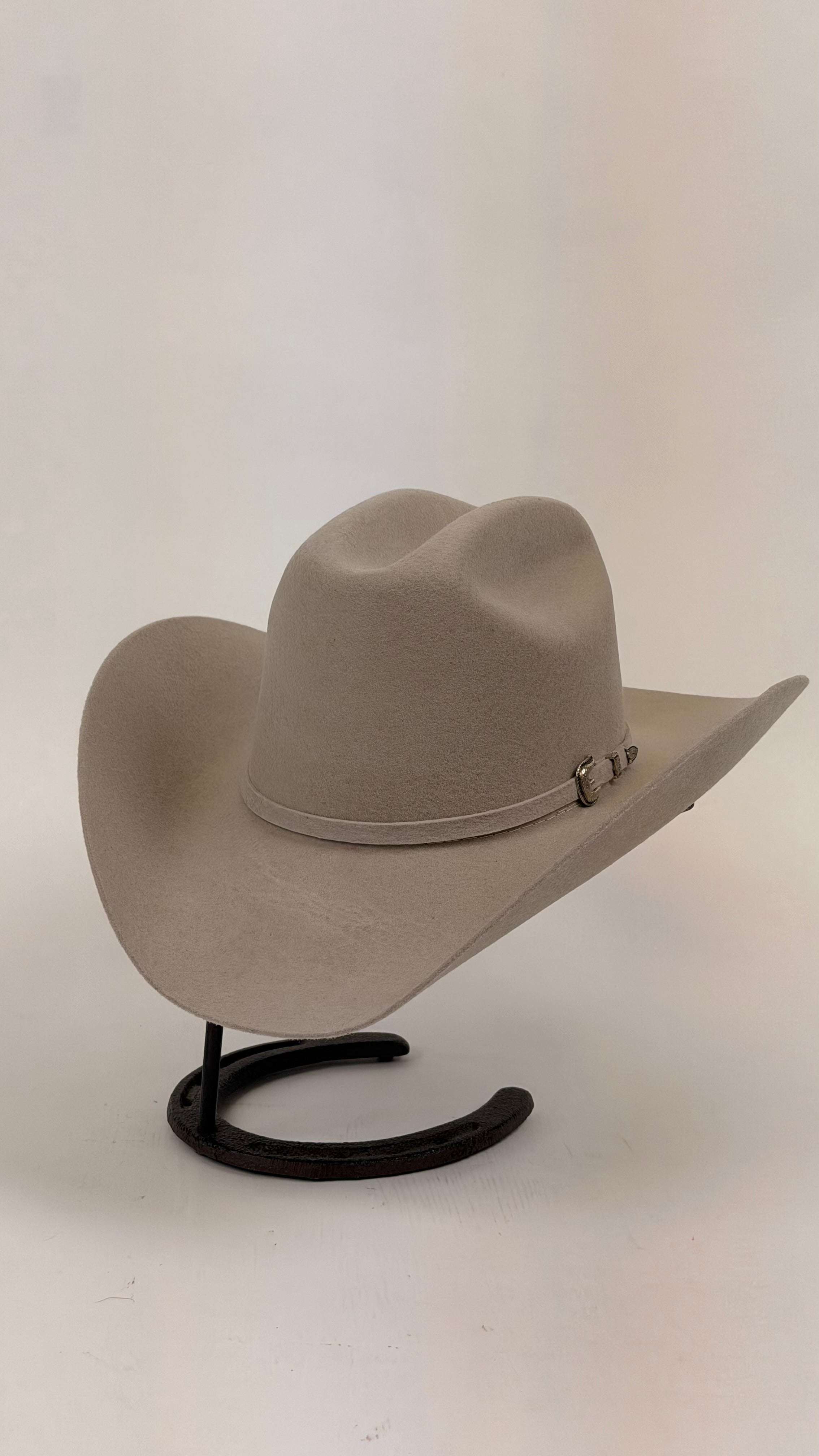 Beige cowboy hat on a black stand