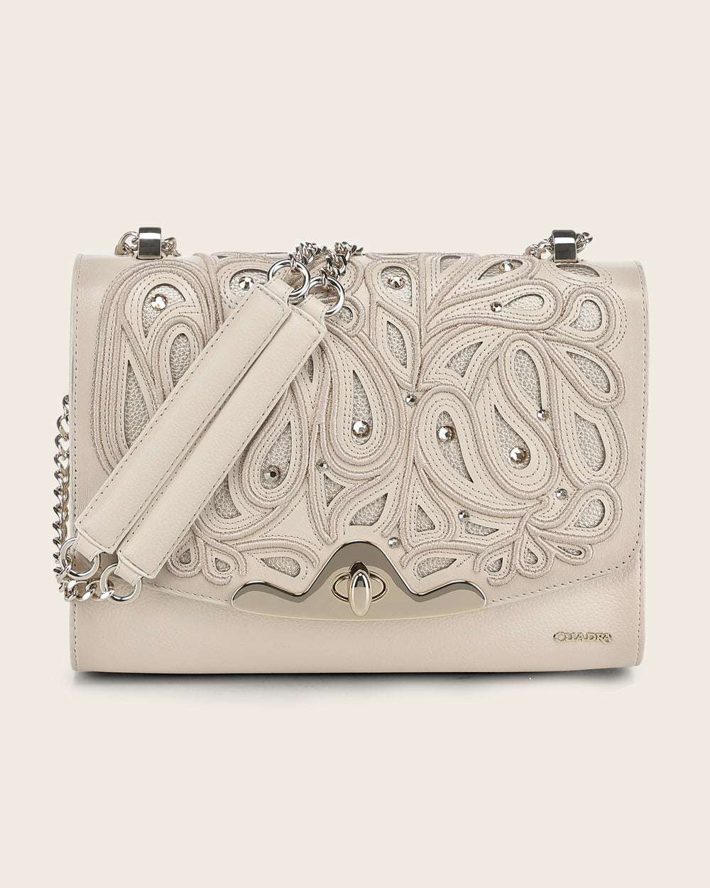 Beige handbag with intricate paisley patterns