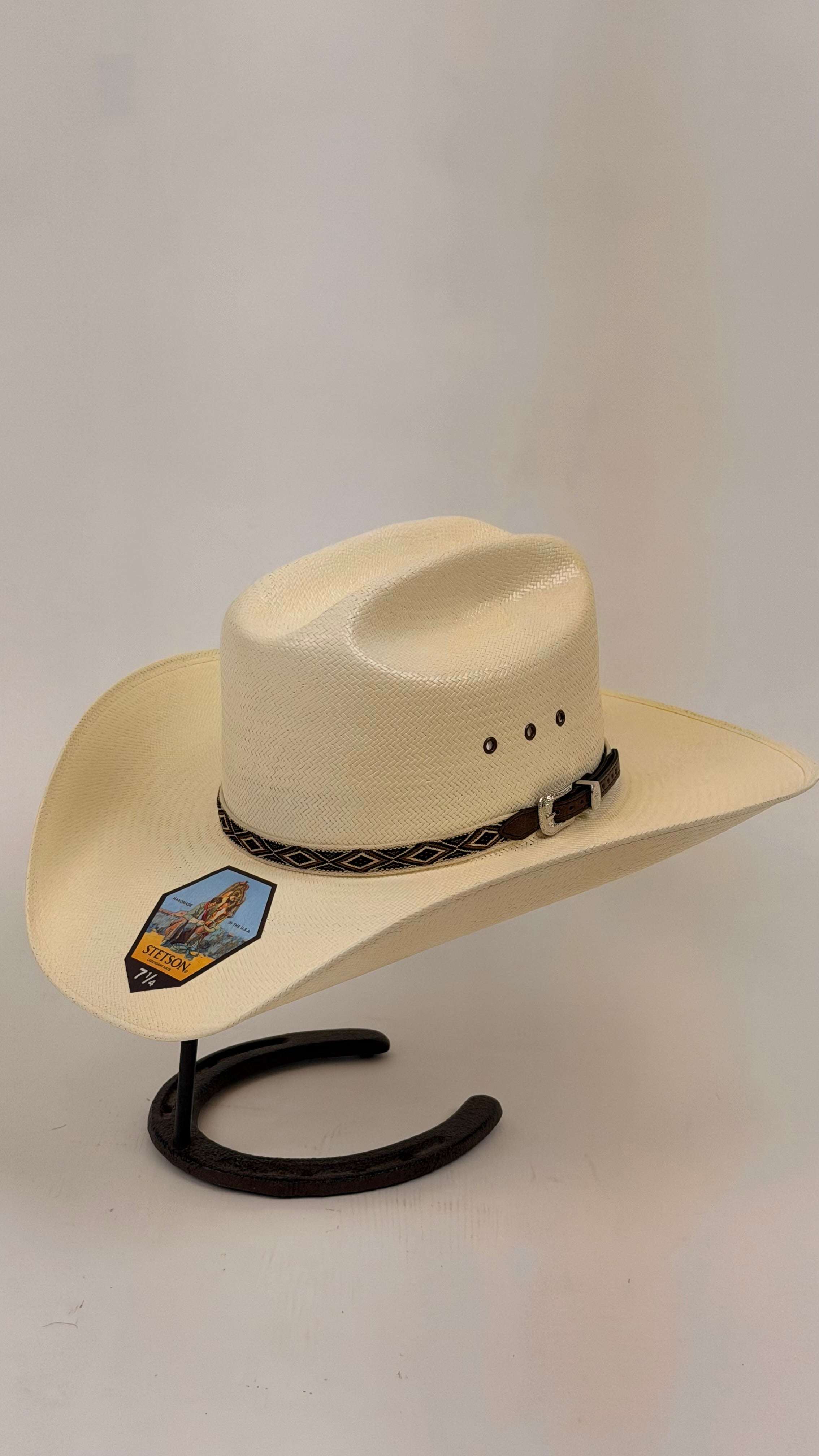 Beige cowboy hat with a decorative band
