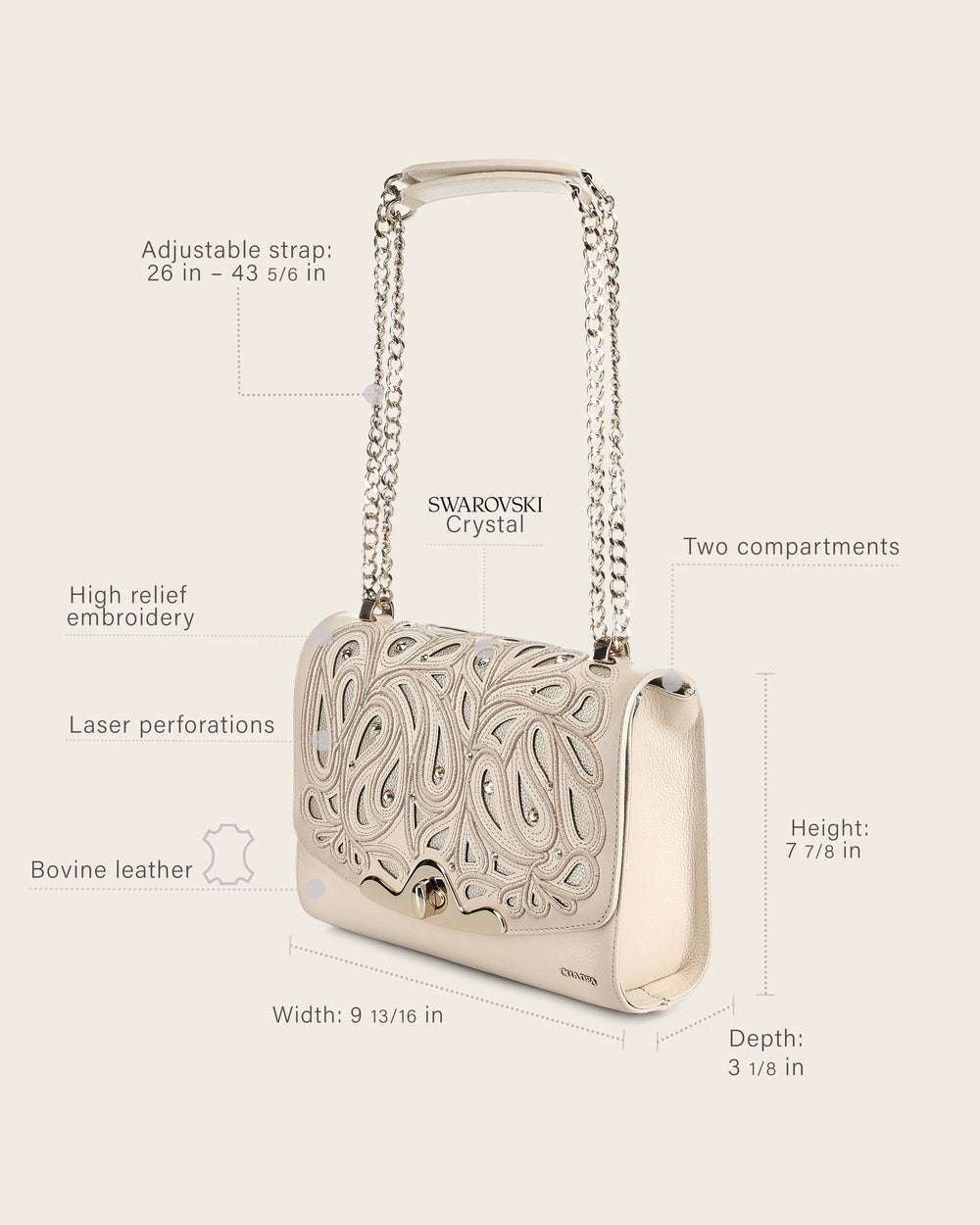 White handbag with intricate designs and Swarovski crystals,