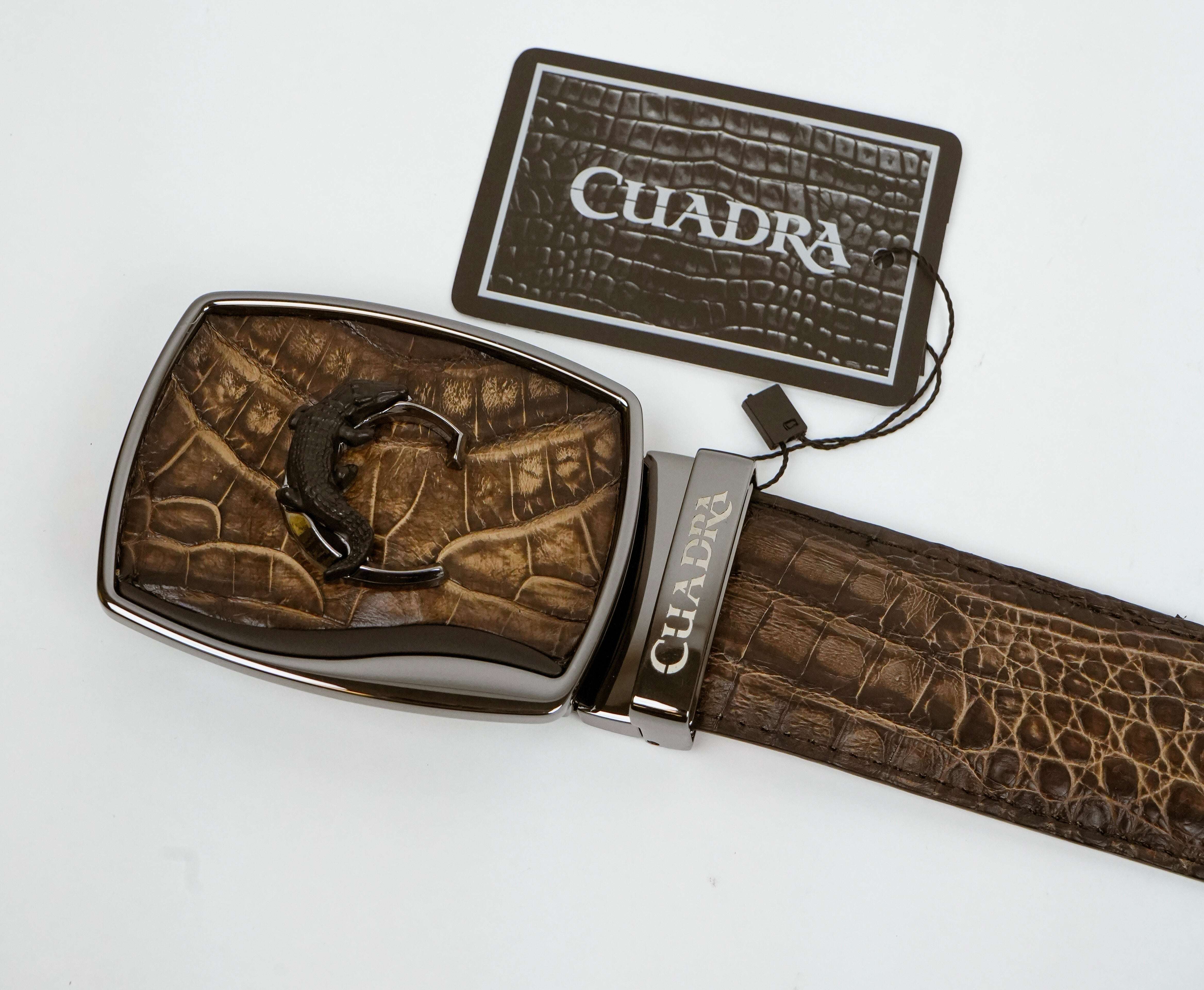 Brown leather belt with silver buckle and 'Cuadra' branding