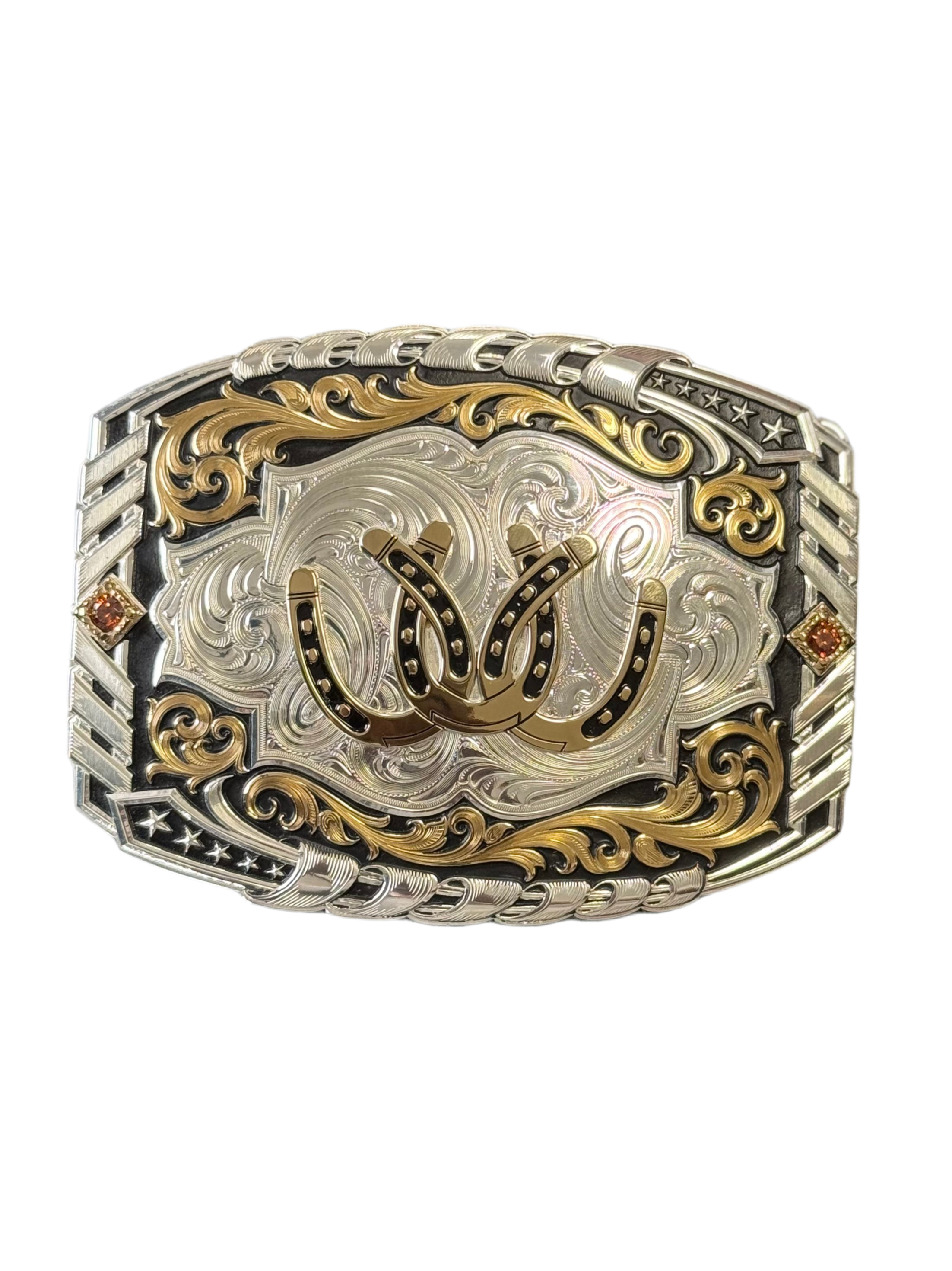 MONTANA SILVERSMITH TWO TONE CANTLE ROLL BUCKLE WITH TRIPLE ENTWINED HORSE SHOES