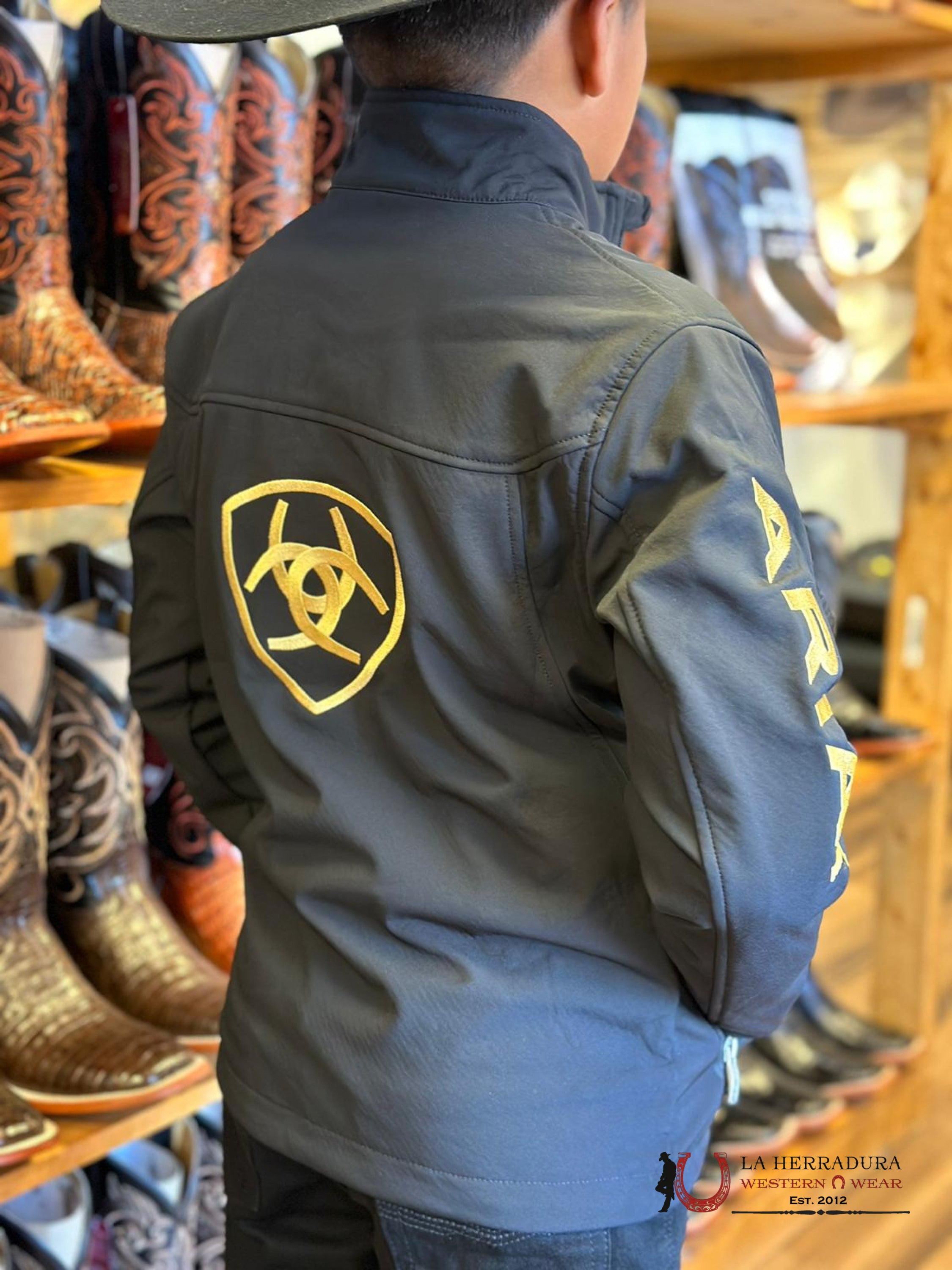 Ariat Youth Soft Shell Jacket Team Logo Black Gold Niños