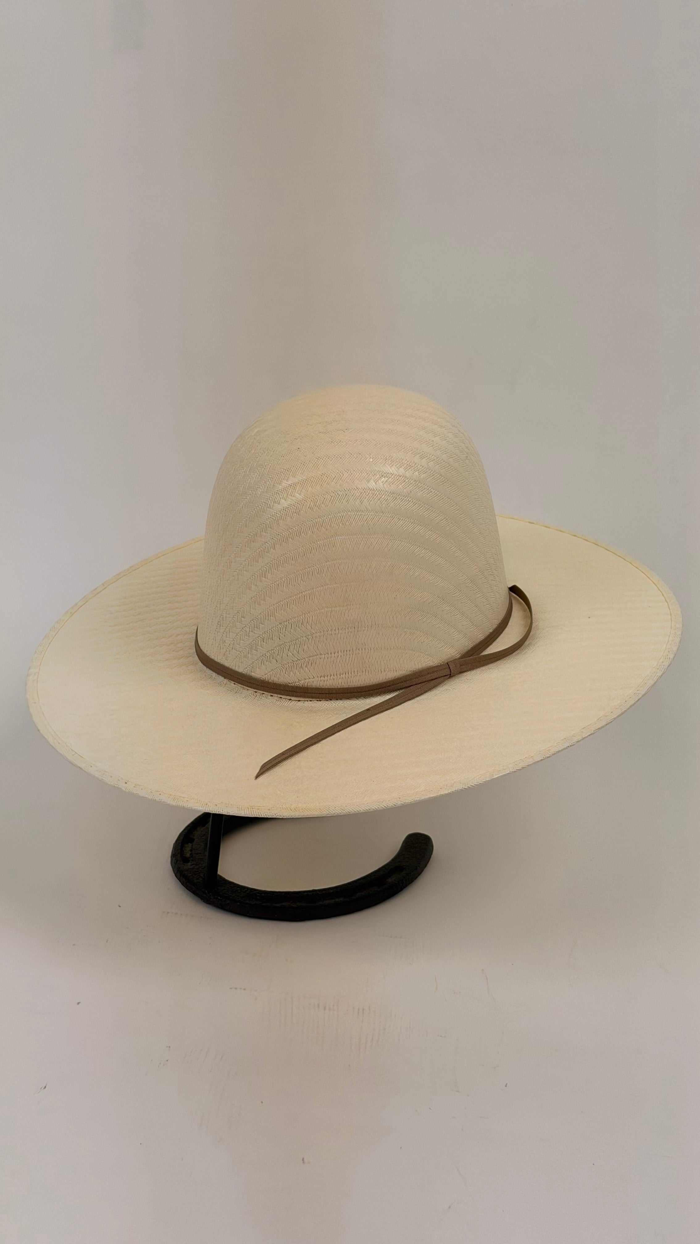 Beige straw hat with a brown band