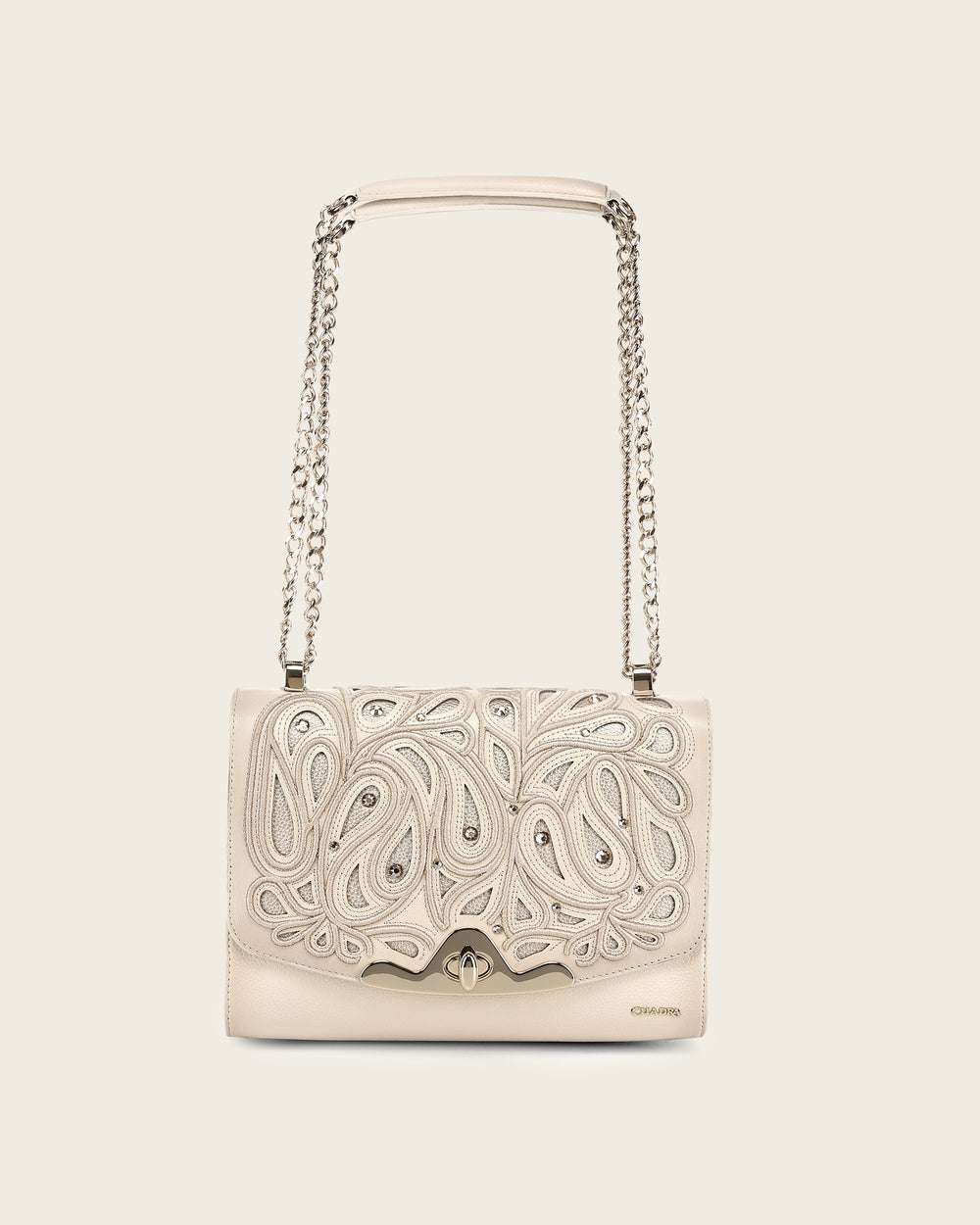 Beige handbag with intricate patterns 