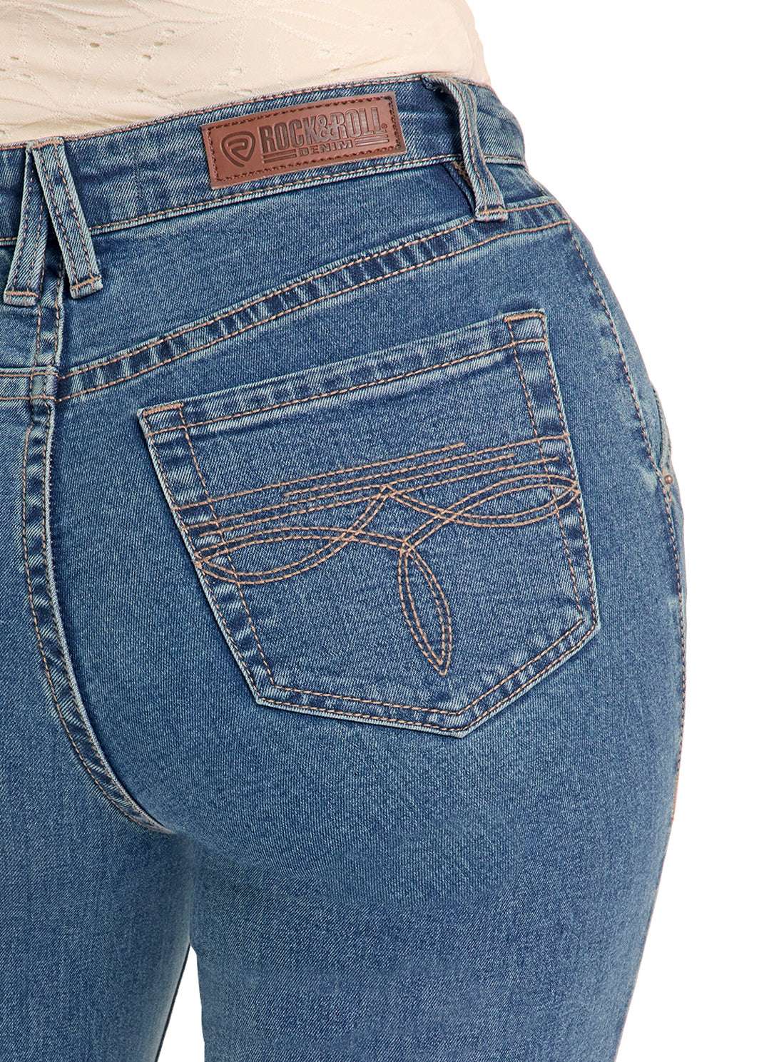 Close-up of blue jeans with a brand logo 
