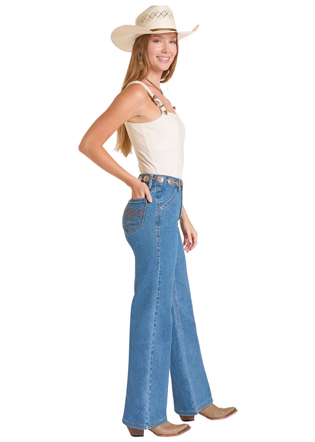 Woman wearing a white tank top, blue jeans, and a cowboy hat