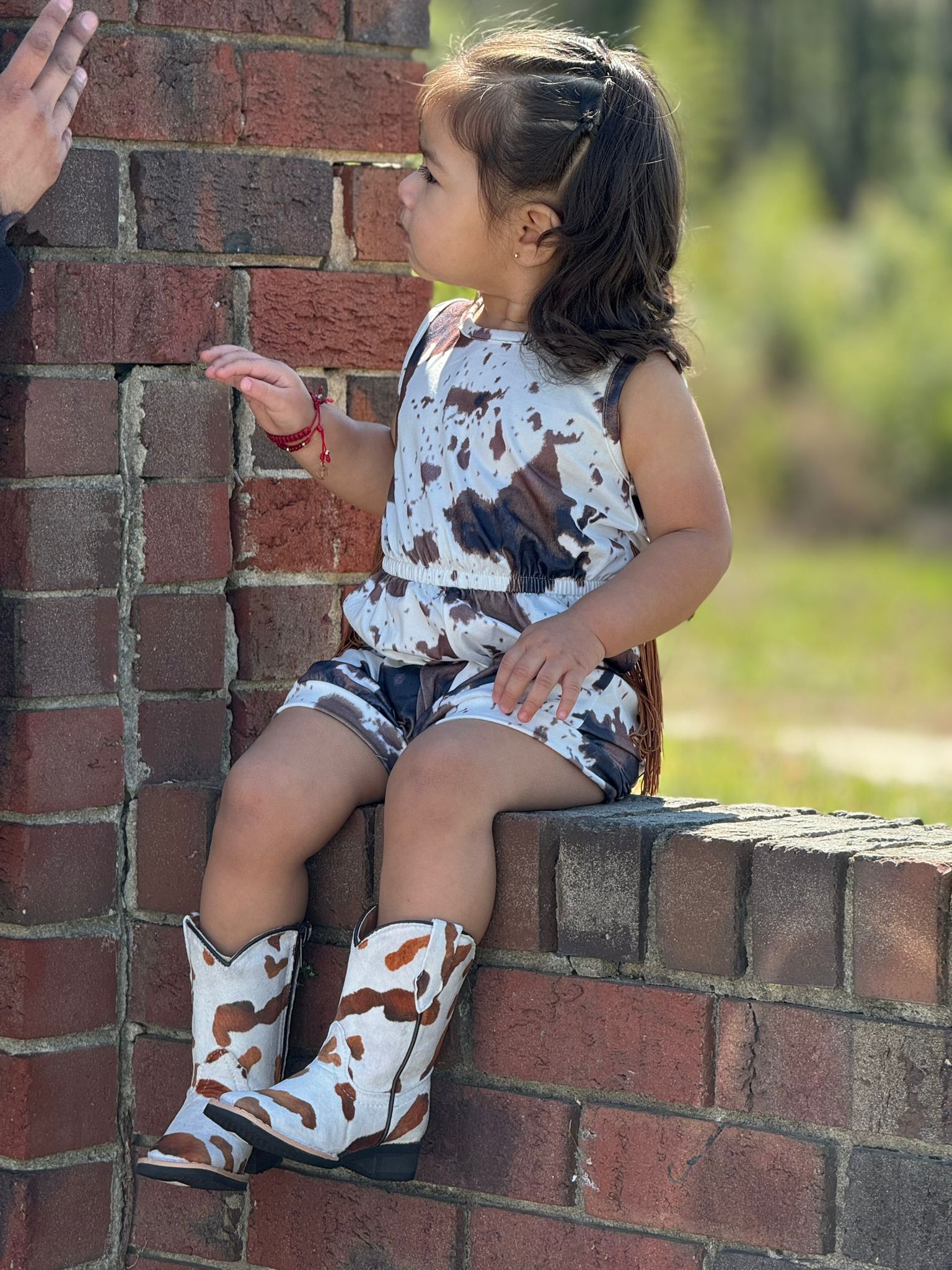 SHEA BABY COWPRINT ONSIE FRINGE BROWN