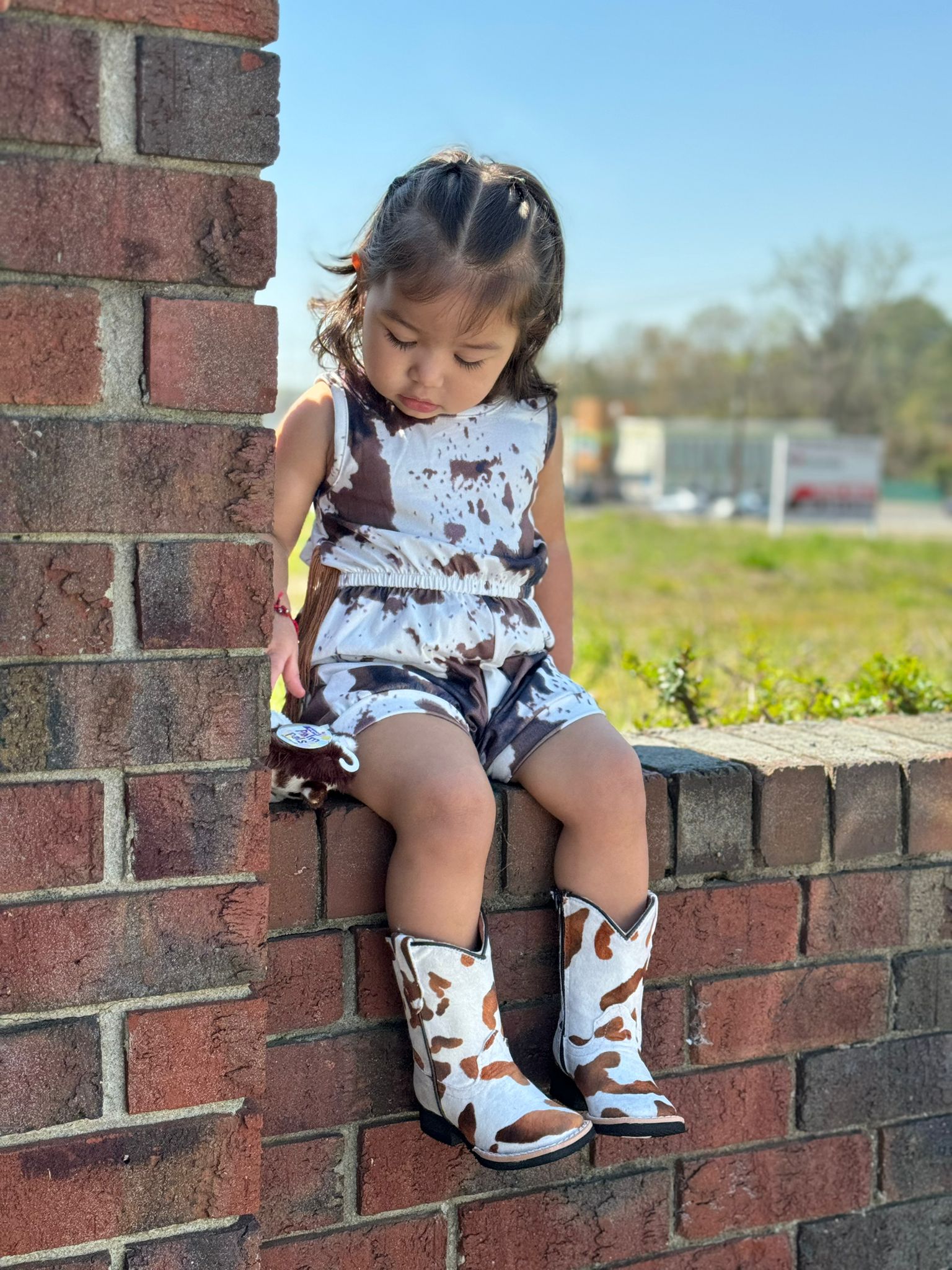 SHEA BABY COWPRINT ONSIE FRINGE BROWN